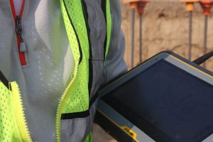Close up of blank tablet screen held by worker