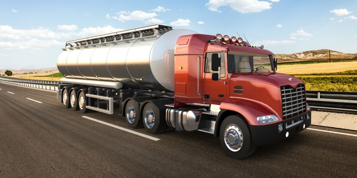 Tank truck driving on highway