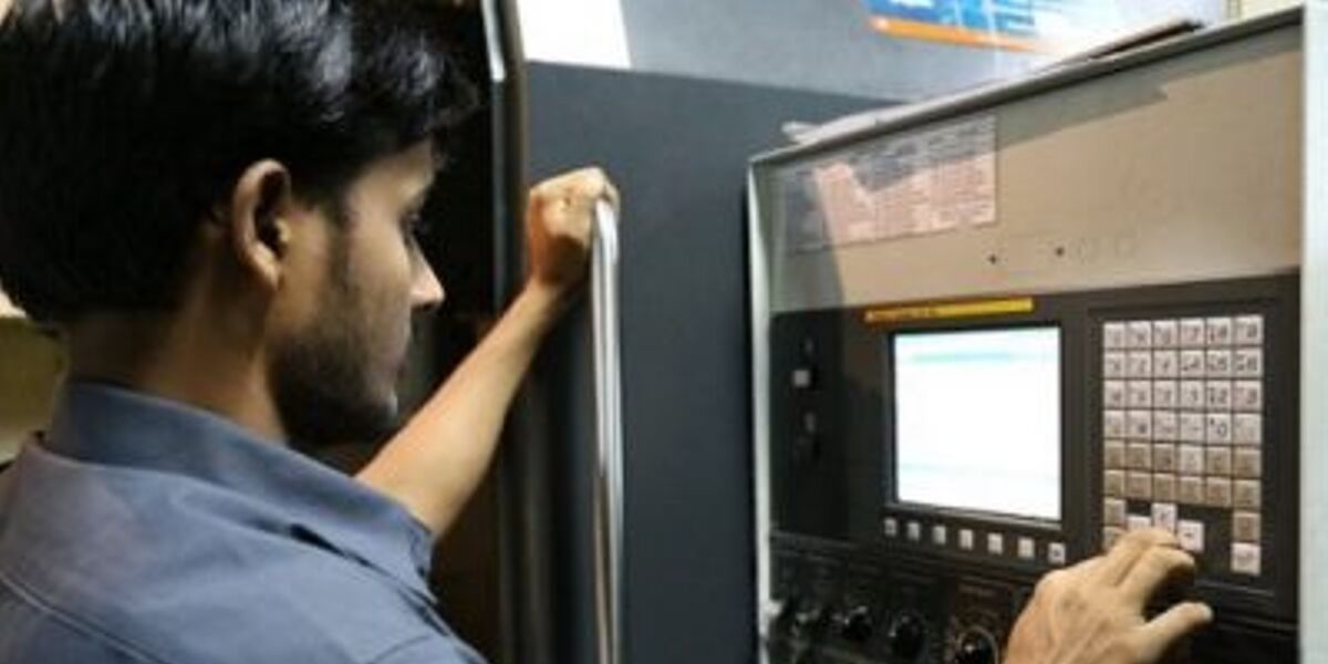Man inputting information into computer machine