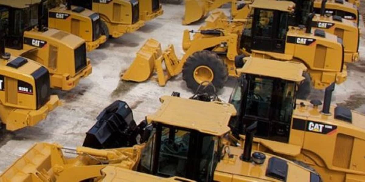 Row of bulldozers in warehouse