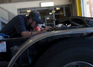 Cat Mechanic servicing a Diesel Engine