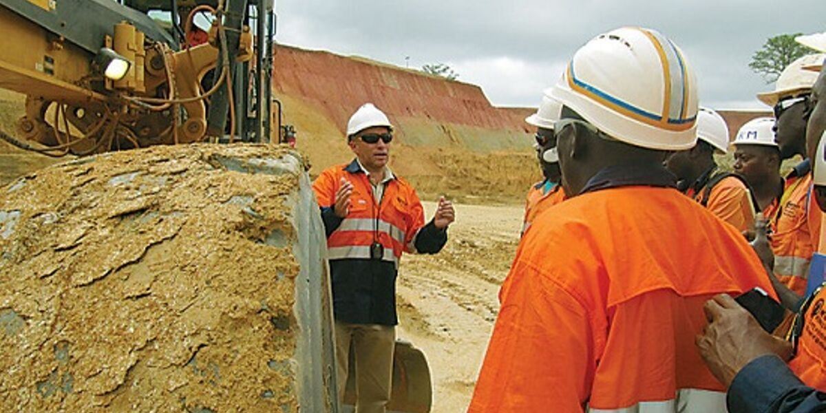 Worker standing at construction site giving instructions