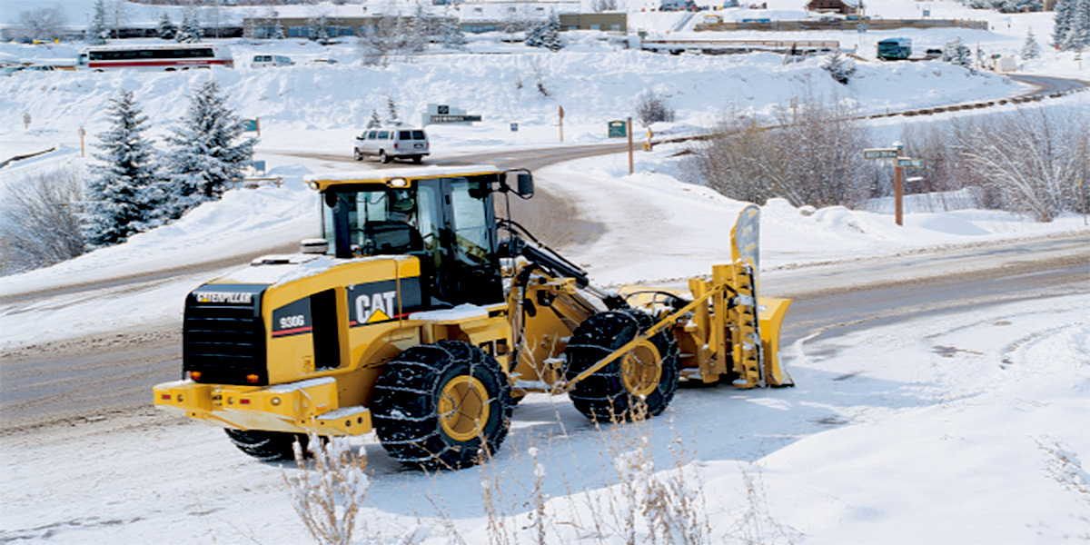 CAT equipment working in winter snow