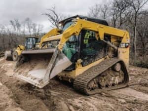 Track dozer in dirt patch in the woods