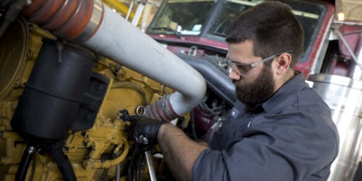 Close up of mechanic working on pipe